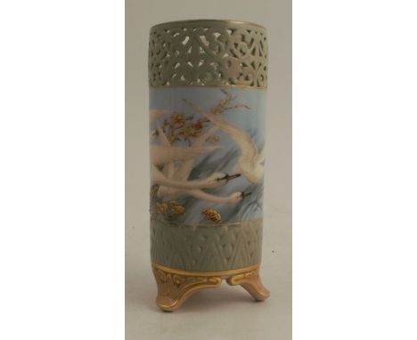 A Royal Worcester cylindrical vase, with pierced upper body, decorated with swans to a powder blue ground, by C H C Baldwyn, 