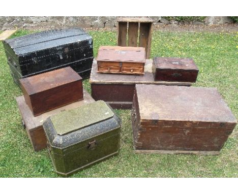 An Antique dome top trunk, together with two pine tool chests, a leather covered casket, another box, a crate and three other