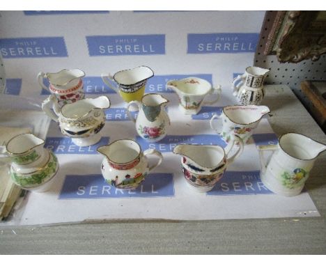 A collection of reproduction Royal Worcester jugs