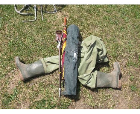 A shooting stick, together with an umbrella, pair of waders and a folding chair