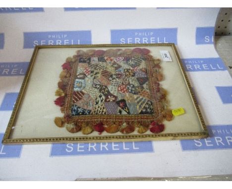 A framed tapestry cushion