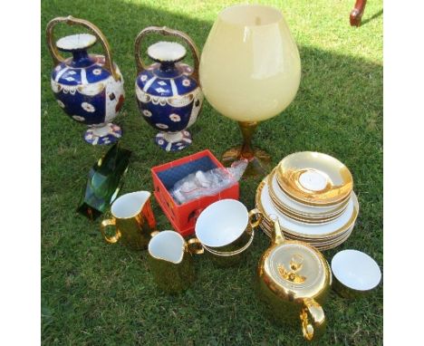 A Royal Worcester gold tea set, together with a pair of vases, thimbles, glass brandy balloon and another vase