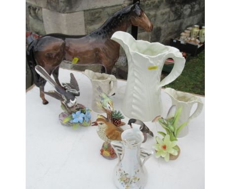 A collection of porcelain, to include a large bay Beswick horse, af, height 12ins, various bird models to include Royal Worce