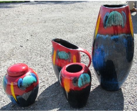 Four Poole pottery items, to include a ginger jar, a jug and two vases, height 15ins and down
