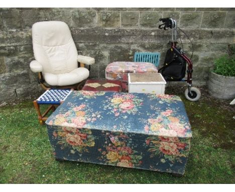 A reclining leather chair, with fire labels, bathroom cabinet,&nbsp; a pouffe with fire labels, a leather example , a blanket