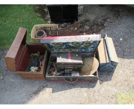 A tin trunk, tools, tin hat, stoneware jar etc