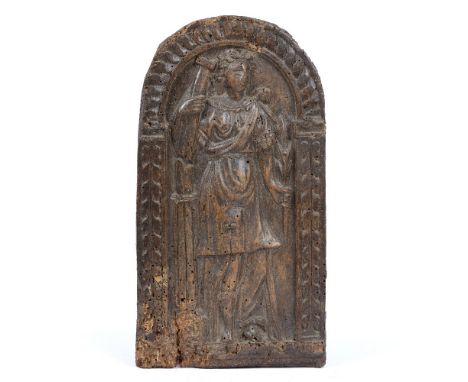 A 17TH OR 18TH CENTURY CARVED WALNUT PANEL depicting a woman in classical dress holding a column and a laurel branch beneath 