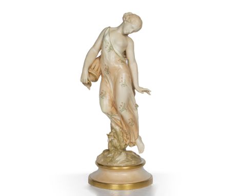 A VICTORIAN ROYAL WORCESTER BLUSH IVORY FIGURINE of a young maiden pouring water from an anaphora, painted with floral sprays