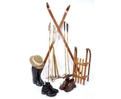 A SPORTING LOT to include a pair of Askjem skis and bamboo poles, two ice axes, two polo sticks, a pair of black leather ridi