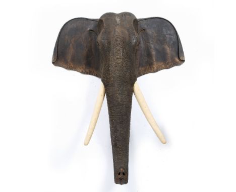 A CARVED WOODEN MODEL OF AN ELEPHANT'S HEAD, TRUNK AND TUSKS 103cm wide x 28cm deep x 124cm high