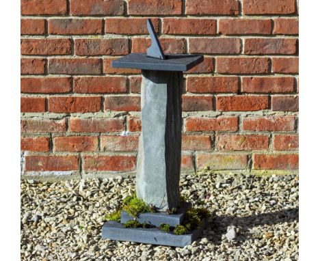 A SLATE SUNDIAL  mounted on a stepped base 30cm wide x 60cm high 