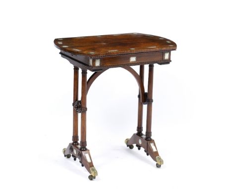 A WILLIAM IV ROSEWOOD OCCASIONAL TABLE with shaped top, column supports to either end and the splaying legs terminating in ca