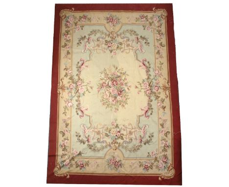 AN 18TH CENTURY FRENCH STYLE CREAM GROUND FLORAL NEEDLEWORK SMALL CARPET with swags of roses, all within a burgundy border, 3