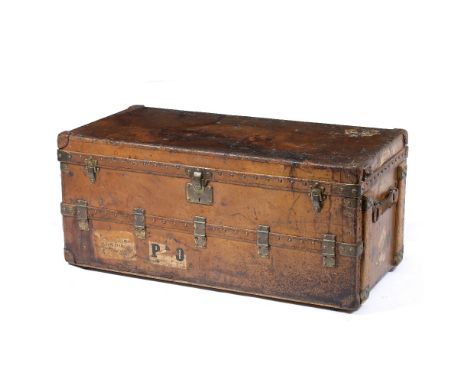 AN EARLY 20TH CENTURY LOUIS VUITTON BROWN LEATHER WARDROBE TRUNK  with brass strapwork and hinges, stamped rivets and fitted 