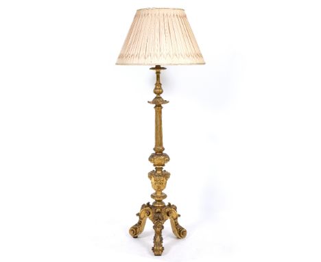 A GILT CARVED WOOD LAMP STANDARD with fluted column support and scrolling tripod base, 159.5cm high to the fitting