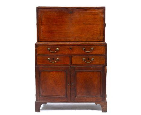 AN EARLY 19TH CENTURY MAHOGANY ESTATE DESK OR BUREAU the upper section with fall front opening to reveal pigeon holes, centra
