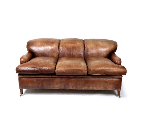 A HOWARD CHAIRS LTD BROWN LEATHER UPHOLSTERED THREE SEATER SOFA 190cm wide x 110cm deep x 89cm high