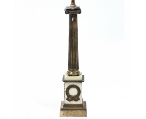 A BRASS AND PAINTED METAL TABLE LAMP in the form of classical fluted column, the plinth base set with a lyre and laurel wreat