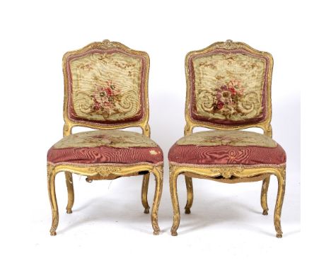 A PAIR OF FRENCH 18TH CENTURY STYLE GILT SIDE CHAIRS with tapestry upholstered backs and seats and standing on cabriole legs,