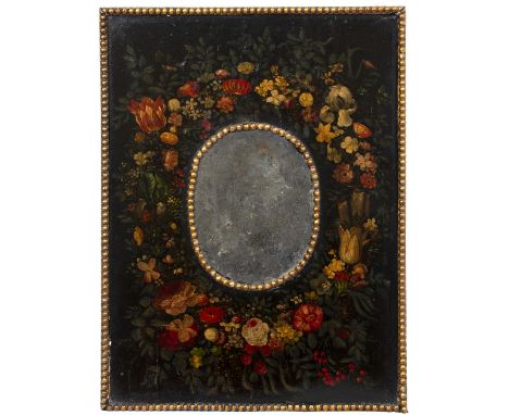 A POSSIBLY 18TH CENTURY WALL MIRROR with central oval mirror plate, surrounded by a panel, decorated with a floral wreath and