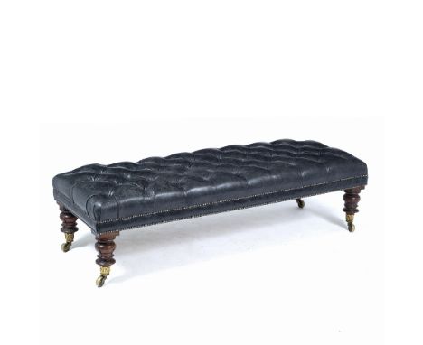 A BLACK LEATHER BUTTON UPHOLSTERED RECTANGULAR FOOT STOOL with carved tapering mahogany legs terminating in leaf cast brass c