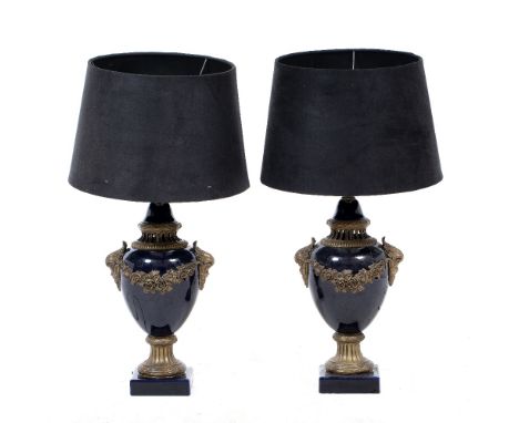 A PAIR OF FRENCH STYLE BLUE GLAZED CAST METAL MOUNTED TABLE LAMPS in the form of urns and covers, complete with black materia