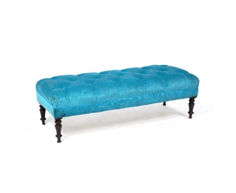 A LIGHT BLUE BUTTON UPHOLSTERED RECTANGULAR STOOL standing on turned tapering legs, 124cm x 47cm x 39cm
