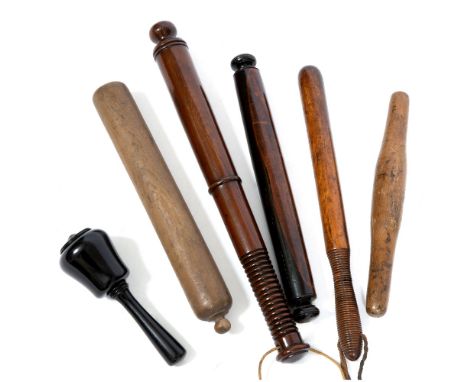 A TURNED EBONY MALLET 19cm long together with two 19th century yew wood rolling pins, a further rolling pin and two truncheon