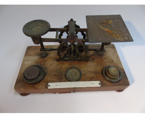 SET OF POSTAL SCALES ON A WOODEN BASE + WEIGHTS