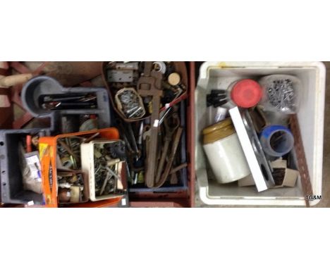 A tray of mixed tools and workshop parts