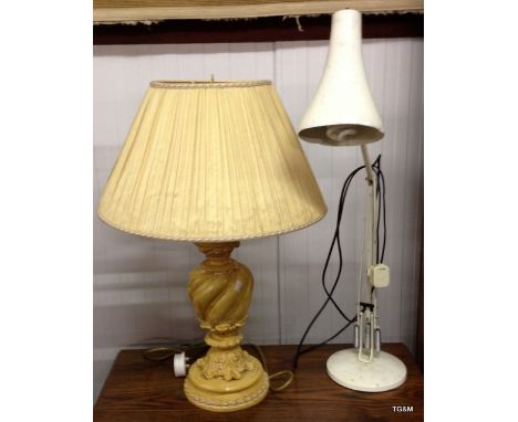 A wooden carved lamp and angle poise lamp