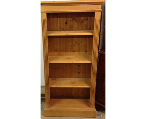 A pine 3 shelf bookcase 138 x 66 x 30