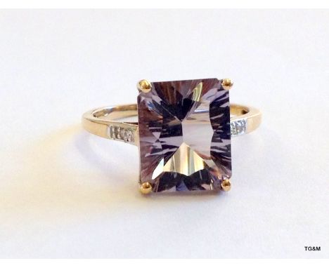 A 9ct gold ladies smoky quartz diamond shoulder ring size R