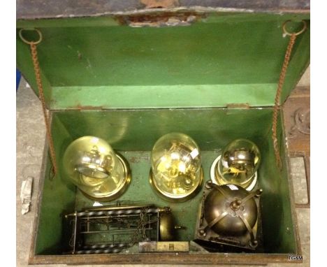 A metal trunk containing a number of anniversary clocks and others