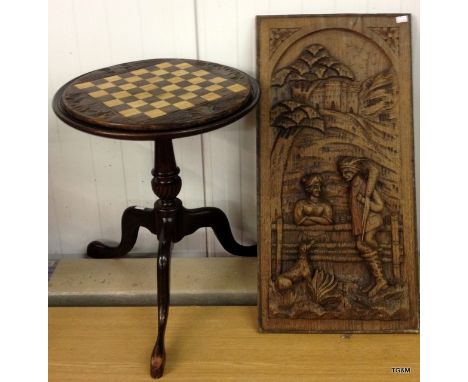 A pedestal games table and an Austrian wall plaque depicting a huntsman