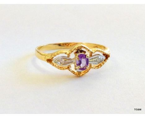 A 9ct gold amethyst and diamond shoulder ladies ring size Q