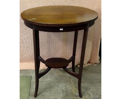 A mahogany inlaid oval lamp table