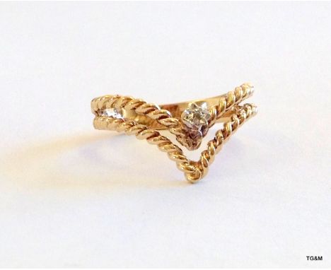 A 9ct gold ladies diamond heart ring