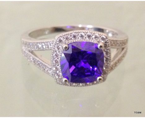 A silver and CZ simulated tanzanite ring