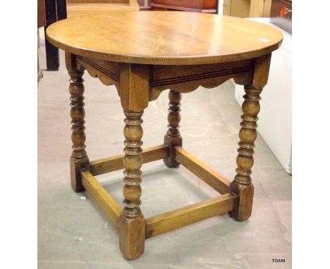 A round oak lamp table