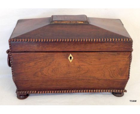 A sarcophagus shaped tea caddy