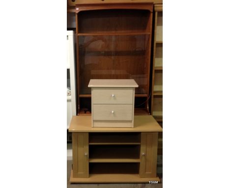 A light wood T.V stand with cd storage cupboards and a 2 drawer chest of drawers and a glass fronted display cabinet