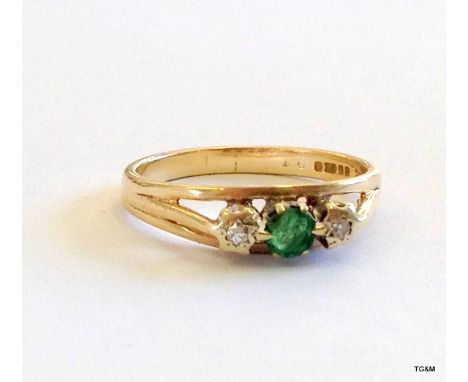 A 9ct gold ladies diamond and emerald ring size O