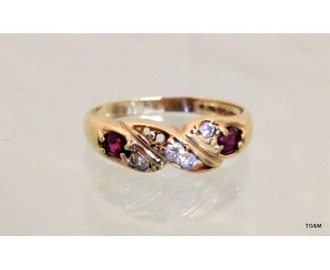 A 9ct gold ladies garnet twist ring size P