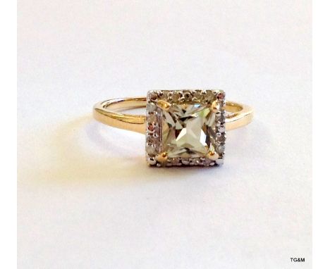 A 9ct gold diamond shoulder square  Peridot ring size N