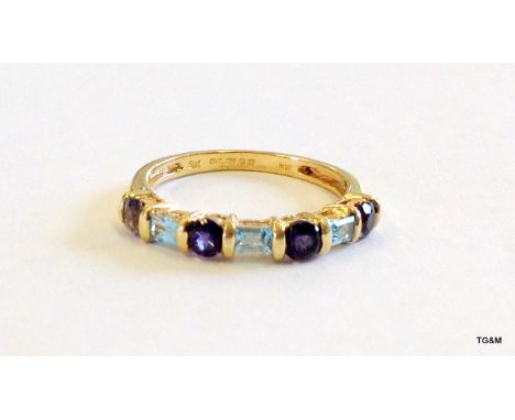 A 9ct gold Tanzanite and aquamarine ladies ring size J