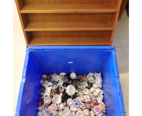 A large collection of miniature china and a wall shelf