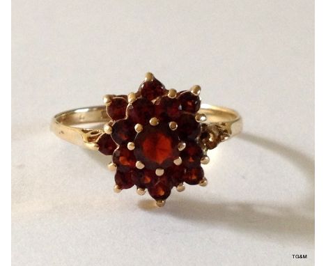 A 9ct gold garnet cluster ring size O