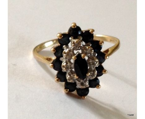 A 9ct gold sapphire cluster ring size M