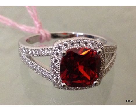 A silver CZ simulated ruby ring